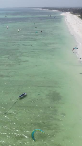 Vertical video kitesurfing near the shore of Zanzibar, Tanzania — Stock Video