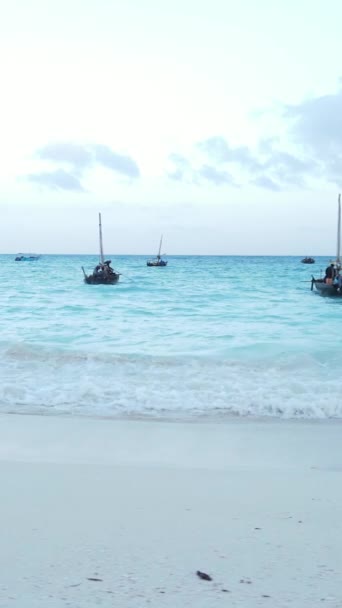 Boat, boats in the ocean near the coast of Zanzibar, Tanzania, slow motion, vertical video — Stock Video