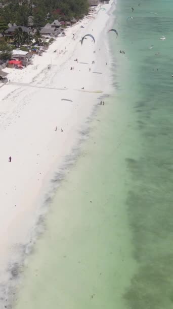 Tanzania - vertical video kitesurfing near the shore of Zanzibar, slow motion — Stock Video