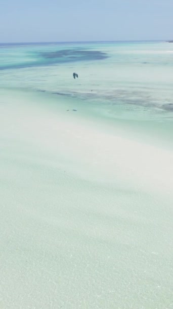 Tanzania - vertical video kitesurfing near the shore of Zanzibar, slow motion — Stock Video