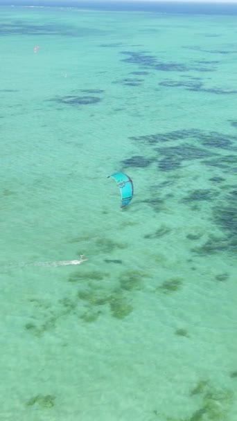 Tanzania - vertical video kitesurfing near the shore of Zanzibar, slow motion — Stock Video