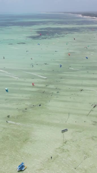 Tanzania - vertical video kitesurfing near the shore of Zanzibar, slow motion — Stock Video