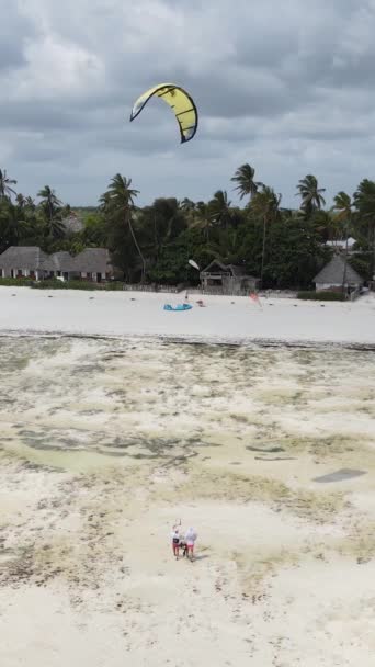 Tanzania - vertical video kitesurfing near the shore of Zanzibar, slow motion — Stock Video