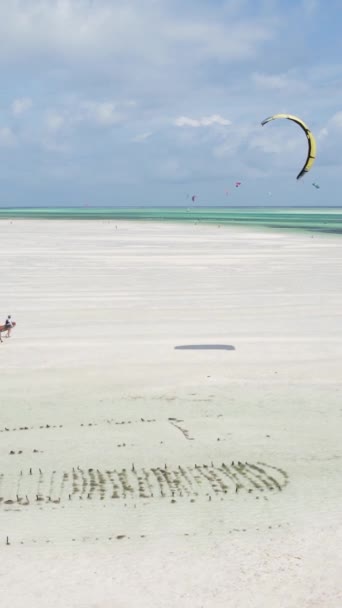 Tanzania - vertical video kitesurfing near the shore of Zanzibar, slow motion — Stock Video