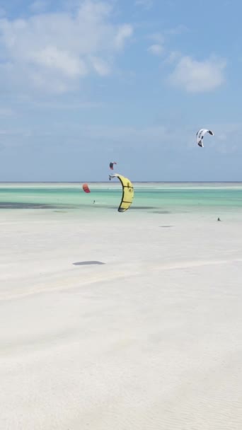 Tanzania - vertical video kitesurfing near the shore of Zanzibar, slow motion — Stock Video