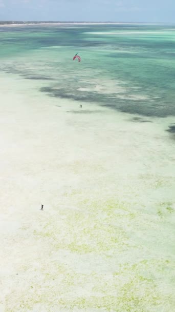 Tanzania - vertical video kitesurfing near the shore of Zanzibar, slow motion — Stock Video