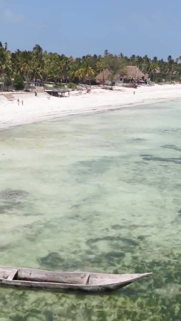 Vertical video of the beach on Zanzibar island, Tanzania, aerial view — Stock Video