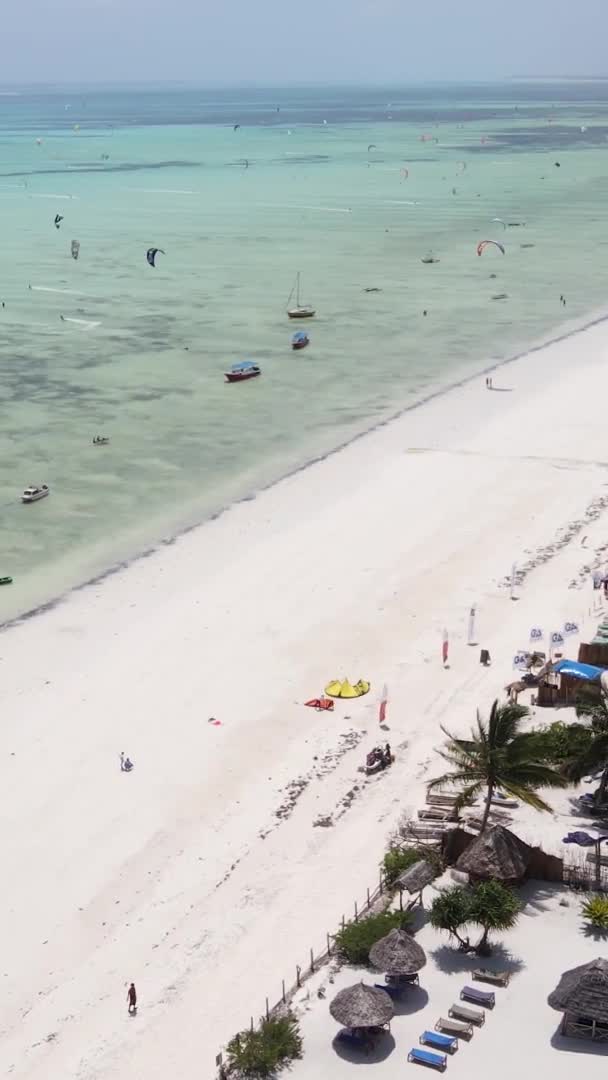 Vertical video kitesurfing near the shore of Zanzibar, Tanzania, aerial view — Stock Video