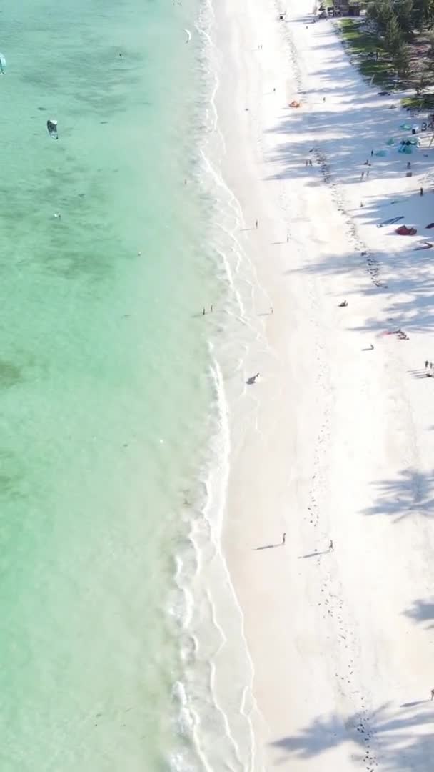 Vertical video boats in the ocean near the coast of Zanzibar, Tanzania, aerial view — Stock Video