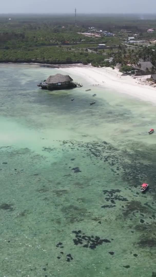 Vertical video of the ocean near the coast of Zanzibar, Tanzania, aerial view — Stock Video