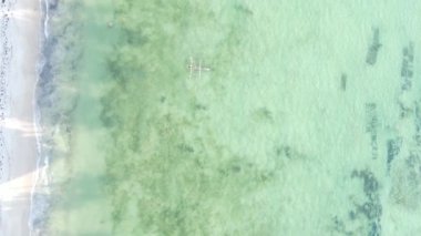 Zanzibar, Tanzania - vertical video of the ocean near the coast, slow motion