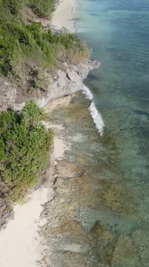 Zanzibar, Tanzania - vertical video of the ocean near the coast, slow motion