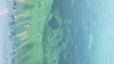 Zanzibar, Tanzania - vertical video of the ocean near the coast, slow motion