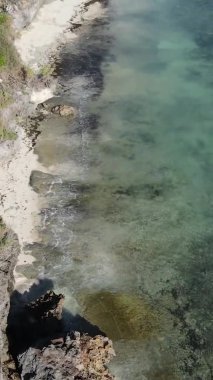 Zanzibar, Tanzania - vertical video of the ocean near the coast, slow motion