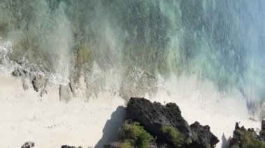 Zanzibar, Tanzania - vertical video of the ocean near the coast, slow motion