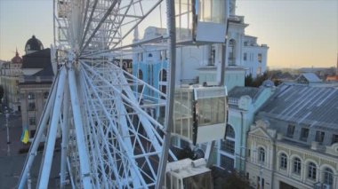 This stock video shows ferris wheel in the morning at sunrise in Kyiv, Ukraine in 8K resolution
