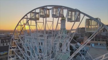 This stock video shows ferris wheel in the morning at sunrise in Kyiv, Ukraine in 8K resolution