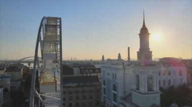 This stock video shows ferris wheel in the morning at sunrise in Kyiv, Ukraine in 8K resolution