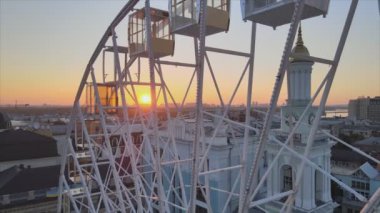 This stock video shows ferris wheel in the morning at sunrise in Kyiv, Ukraine in 8K resolution