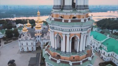 This stock video shows an aerial view of the Kyiv-Pechersk Lavra in the morning at sunrise, Ukraine in 8K resolution