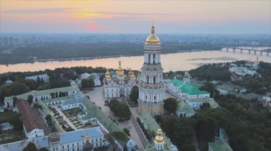 This stock video shows an aerial view of the Kyiv-Pechersk Lavra in the morning at sunrise, Ukraine in 8K resolution