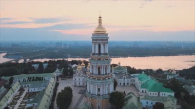 This stock video shows an aerial view of the Kyiv-Pechersk Lavra in the morning at sunrise, Ukraine in 8K resolution
