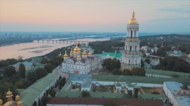 This stock video shows an aerial view of the Kyiv-Pechersk Lavra in the morning at sunrise, Ukraine in 8K resolution