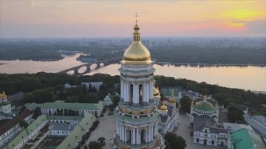 This stock video shows an aerial view of the Kyiv-Pechersk Lavra in the morning at sunrise, Ukraine in 8K resolution