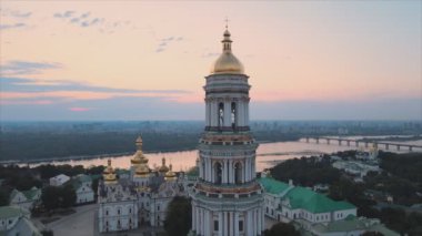 This stock video shows an aerial view of the Kyiv-Pechersk Lavra in the morning at sunrise, Ukraine in 8K resolution
