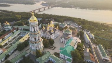 This stock video shows an aerial view of the Kyiv-Pechersk Lavra in the morning at sunrise, Ukraine in 8K resolution