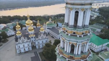 This stock video shows an aerial view of the Kyiv-Pechersk Lavra in the morning at sunrise, Ukraine in 8K resolution