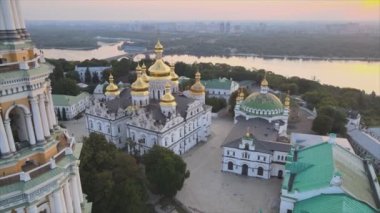This stock video shows an aerial view of the Kyiv-Pechersk Lavra in the morning at sunrise, Ukraine in 8K resolution