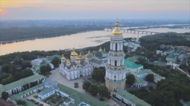 This stock video shows an aerial view of the Kyiv-Pechersk Lavra in the morning at sunrise, Ukraine in 8K resolution