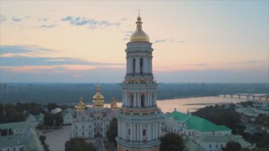 This stock video shows an aerial view of the Kyiv-Pechersk Lavra in the morning at sunrise, Ukraine in 8K resolution