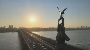 This stock footage shows aerial view of metro bridge in the morning at sunrise in Kyiv, Ukraine in 8K resolution