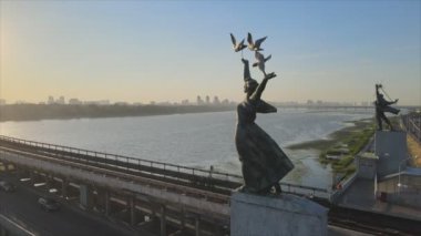 This stock footage shows aerial view of metro bridge in the morning at sunrise in Kyiv, Ukraine in 8K resolution