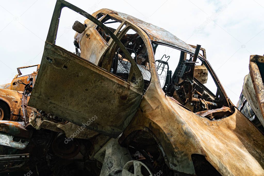 This stock photo shows a dump of shot and burned cars in Irpin, Bucha district