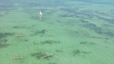 This stock video shows boats in the ocean off the coast of Zanzibar in 8K resolution