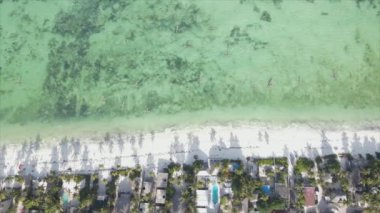 This stock video shows boats in the ocean off the coast of Zanzibar in 8K resolution