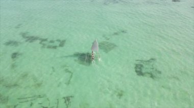 This stock video shows boats in the ocean off the coast of Zanzibar in 8K resolution