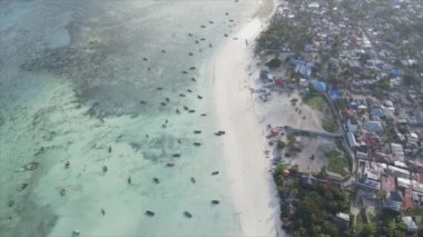 This stock video shows boats in the ocean off the coast of Zanzibar in 8K resolution