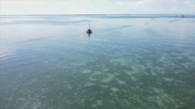 This stock video shows boats in the ocean off the coast of Zanzibar in 8K resolution