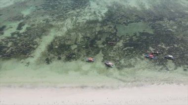 This stock video shows boats in the ocean off the coast of Zanzibar in 8K resolution