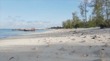 This stock video shows an empty beach on the island of Zanzibar, Tanzania, slow motion in 8K resolution