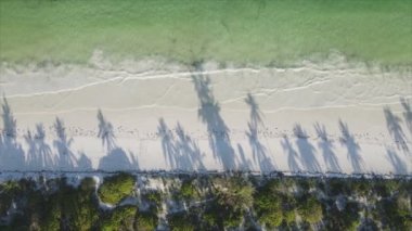 This stock video shows an empty beach on the island of Zanzibar, Tanzania, slow motion in 8K resolution