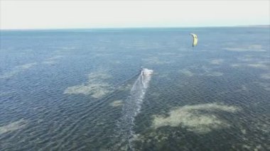 This stock video shows kitesurf near the coast of Zanzibar, Tanzania in 8K resolution