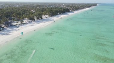 This stock video shows kitesurf near the coast of Zanzibar, Tanzania in 8K resolution