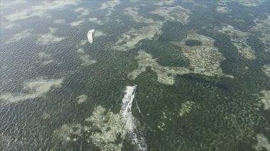 This stock video shows kitesurf near the coast of Zanzibar, Tanzania in 8K resolution