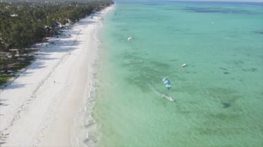 This stock video shows kitesurf near the coast of Zanzibar, Tanzania in 8K resolution