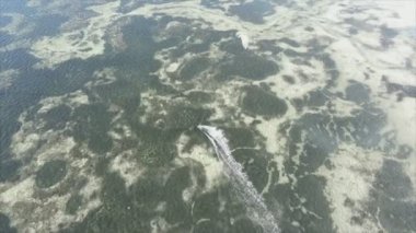 This stock video shows kitesurf near the coast of Zanzibar, Tanzania in 8K resolution